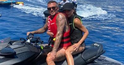 Victoria Beckham looks terrified as she reluctantly joins husband David on jet ski