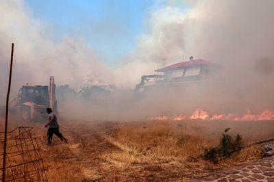 Hundreds evacuated from Greek resort as Lesbos fires rage