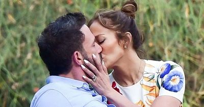 Jennifer Lopez and Ben Affleck snog on a bench as honeymoon gets off to a steamy start