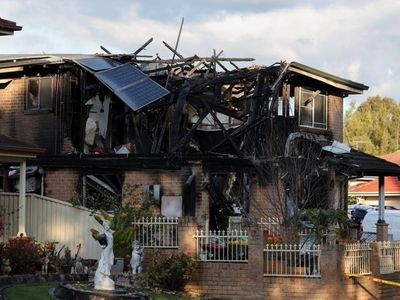 'Raging' house fire kills three in Sydney