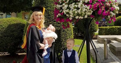 Woman who flunked and was told she'd never have kids graduates with two children