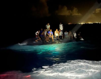 Bahamian officials search for survivors after boat sinks