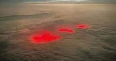 Pilot spots red glow below clouds that people believe 'could be the end of time'