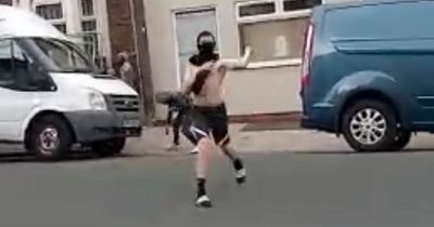 Terrifying moment balaclava-clad youths hurl stones at family's home