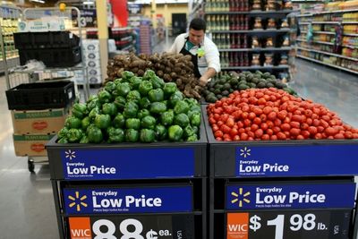 Walmart cuts profit outlook as inflation bites shoppers