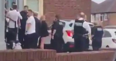 Shocking moment mourners 'pepper sprayed' as mass brawl at funeral spills into street