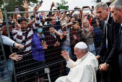 Pope has fun, security frets, as pontiff takes wheelchair detour