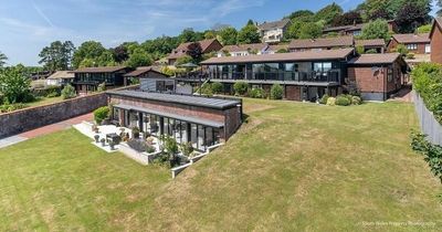 Designer glass-fronted home inside exclusive development with a hidden corridor to bonus annexe