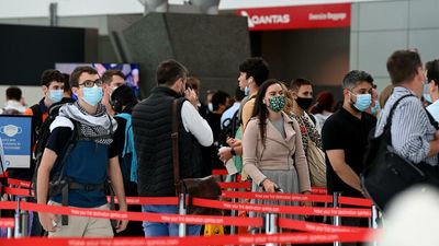 Qantas to cut flights, hire more staff