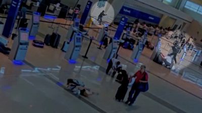 New video shows woman opening fire at Dallas airport before police officer shot her