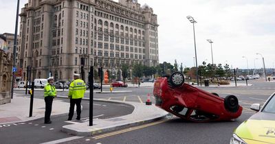 Car flips on roof and windows smashed in city centre crash