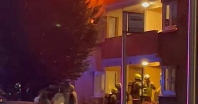 Fire rips through top floor Scots flat as crews tackle blaze in dramatic footage