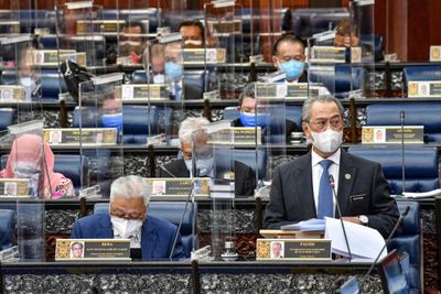 Malaysia bans party-hopping MPs from toppling government