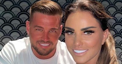 Katie Price takes engagement ring off as Carl Woods is missing from family photo