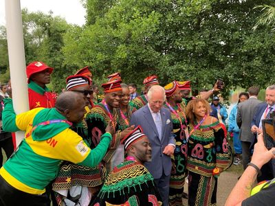 Charles poses for selfies with Commonwealth Games athletes ahead of opening