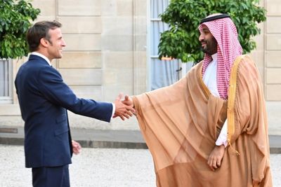 Macron defies anger to welcome Saudi strongman