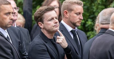 Dec Donnelly fights back tears as he carries Priest brother Dermott's coffin into funeral