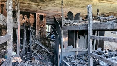 Eight people killed in Moscow hostel fire after bars on window stop escape