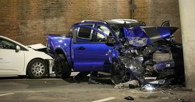 Engineers assess structure of railway bridge after two-car smash