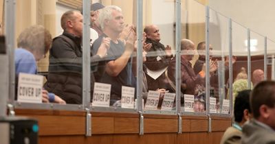 Council issues banning letters to residents after two rowdy town hall meetings where protesters 'banged' barriers