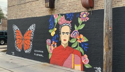 Frida Kahlo, a monarch butterfly and flowers brighten a Maywood alley in artist Yekseny Guerrero’s first public mural