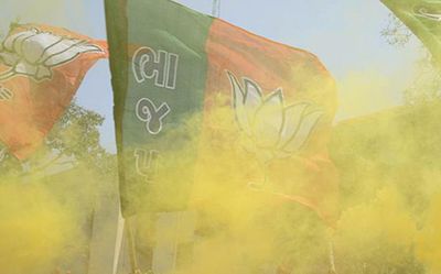 Posters, hoardings, huge arches and saffron flags flood Patna