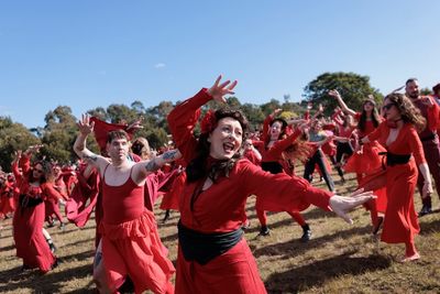 Kate Bush fans gather in red dresses for ‘The Most Wuthering Heights Day Ever’