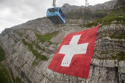 World's biggest Swiss flag unfurled on Alpine cliff