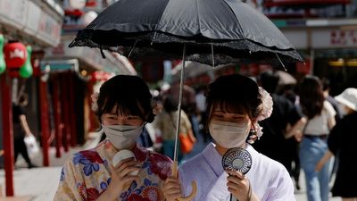 Habitual mask-wearing is likely helping Japan, Singapore and South Korea bring daily Omicron deaths down, epidemiologists say