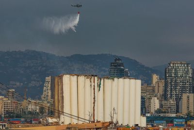 Part of damaged Beirut port silos collapses after weeks-long fire