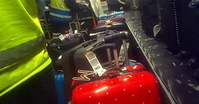 Desperate Manchester Airport passengers spotted crawling through baggage hatch