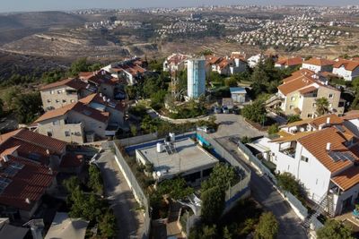 Palestinian family encircled by Israeli settlement