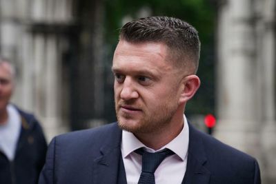 Tommy Robinson fined for contempt of court after failing to appear at High Court