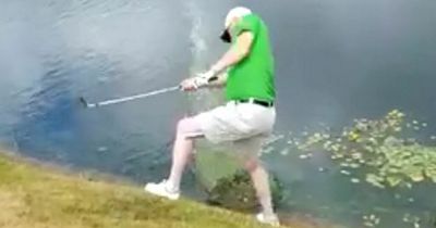 Hilarious moment golfer falls in lake trying to play ball at Nottinghamshire course