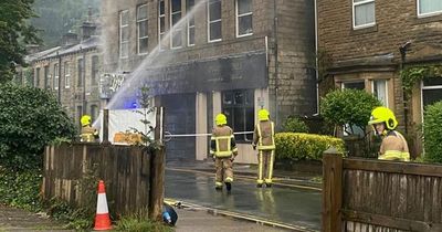 Homes evacuated as Manchester fire crews help tackle huge blaze in beauty spot town