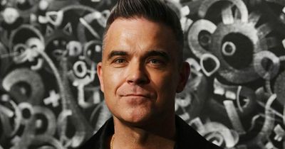 Robbie Williams reveals how he's coping with losing his hair at 48