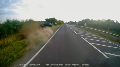 A Car Crashed Into A Ditch As It Overtook A Truck