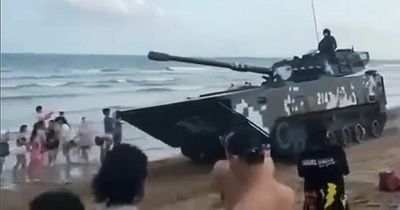 Chinese tanks seen rolling on packed beaches with war fears over Taiwan boiling over