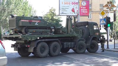 Pro-Russian, So-Called DPR Makes Show Of Clearing City Streets Of Mines As Locals Walk Around