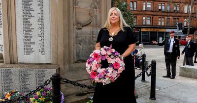 Town turns out to honour war dead in rededication ceremony that stopped traffic for seven minutes