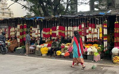Soaring prices of flowers and fruits fail to dampen festive spirit