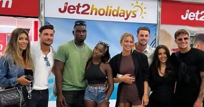 Love Island star Dami Hope won't reunite with family yet as he lands back in UK with Indiyah Polack