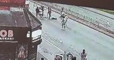 Huge armed brawl bursts from restaurant into middle of street and leaves man 'out cold'