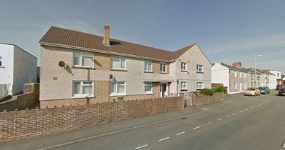 Two rescued from town flat fire after suspected arson