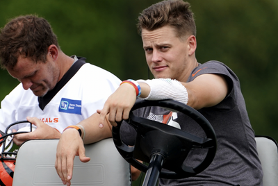 Joe Burrow chilled out on a golf cart while Bengals teammates ran conditioning sprints