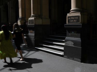 Dad reached over kids to fatally stab mum