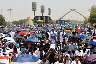 Followers of Iraq's Sadr pray at Saddam-era parade ground
