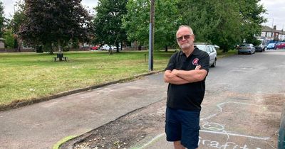 Man put up his own parking blockade to stop parents pulling up near his house - with neighbours at war