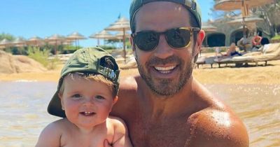 Jamie Redknapp cuddles adorable baby son on family holiday alongside wife Frida