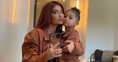 Kylie Jenner shows extreme shoulder pad-chic style out in London with Stormi